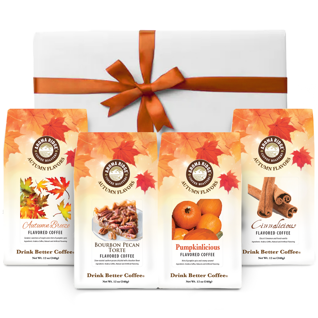 Collection of coffee packages with autumn-themed design and a gift box with an orange ribbon.